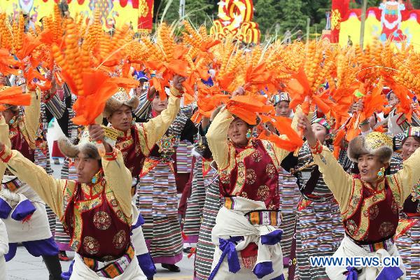 People take part in a grand celebration parade marking the 60th anniversary of Tibet's peaceful liberation in Lhasa, capital of southwest China's Tibet Autonomous Region, on July 19, 2011.