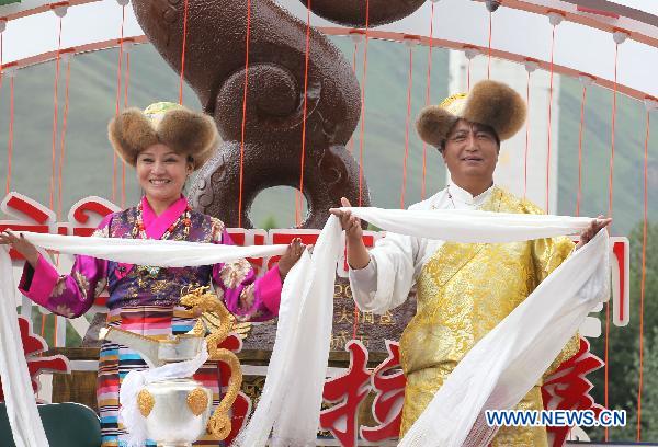 People take part in a grand celebration parade marking the 60th anniversary of Tibet&apos;s peaceful liberation in Lhasa, capital of southwest China&apos;s Tibet Autonomous Region, on July 19, 2011.