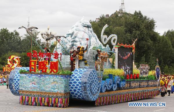 People take part in a grand celebration parade marking the 60th anniversary of Tibet&apos;s peaceful liberation in Lhasa, capital of southwest China&apos;s Tibet Autonomous Region, on July 19, 2011.