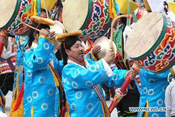 People take part in a grand celebration parade marking the 60th anniversary of Tibet&apos;s peaceful liberation in Lhasa, capital of southwest China&apos;s Tibet Autonomous Region, on July 19, 2011.