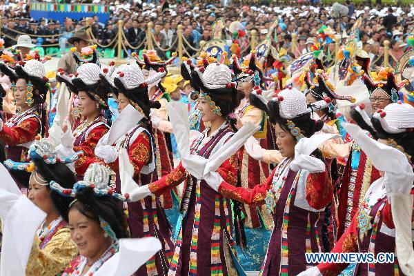 People take part in a grand celebration parade marking the 60th anniversary of Tibet's peaceful liberation in Lhasa, capital of southwest China's Tibet Autonomous Region, on July 19, 2011.