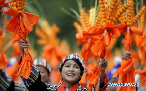 People take part in a grand celebration parade marking the 60th anniversary of Tibet's peaceful liberation in Lhasa, capital of southwest China's Tibet Autonomous Region, on July 19, 2011.