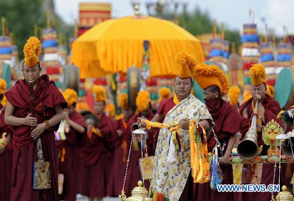 People take part in a grand celebration parade marking the 60th anniversary of Tibet's peaceful liberation in Lhasa, capital of southwest China's Tibet Autonomous Region, on July 19, 2011.