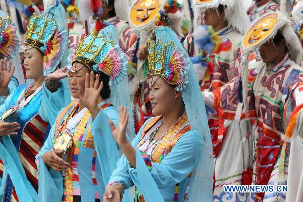 People take part in a grand celebration parade marking the 60th anniversary of Tibet's peaceful liberation in Lhasa, capital of southwest China's Tibet Autonomous Region, on July 19, 2011.