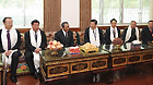 Chinese Vice President Xi Jinping (4th R), who is also a member of the Standing Committee of the Political Bureau of the Chinese Communist Party (CPC) Central Committee and vice chairman of the Central Military Commission, chats with senior Tibetan leader Raidi (3rd L), vice chairman of the Standing Committee of China's 10th National People's Congress (NPC), at Raidi's home in Lhasa, capital of southwest China's Tibet Autonomous Region, July 18, 2011.