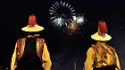 Tibetans watch fireworks light up the sky at Potala Palace Square in Lhasa to celebrate the 60th anniversary of the peaceful liberation of Tibet on July 19, 2011.