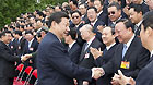 Chinese Vice President Xi Jinping (L Front), who is also a member of the Standing Committee of the Political Bureau of the Chinese Communist Party (CPC) Central Committee and vice chairman of the Central Military Commission, meets with representatives to a symposium on the 'pairing-up support' program in Lhasa, southwest China's Tibet Autonomous Region, July 20, 2011.