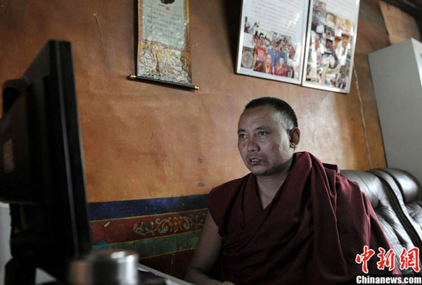 A monk is using computer to record Buddhist activities held by the Sera Monastery, one of the three major monasteries of the Gelug Sect in Lhasa, southwest China&apos;s Tibet Autonomous Region. There are more than 20 computers in the monastry.