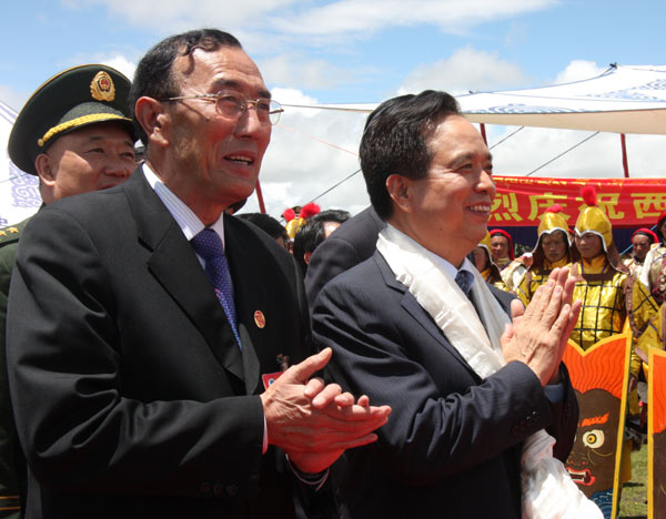 Li Jianguo (right), deputy chief of a central government delegation sent to attend the celebrations marking the 60th anniversary of Tibet's peaceful liberation, and Qiangba Puncog (left), head of the standing committee of the Tibet Autonomous Region's people's congress, greet people participating in a gala in Nagqu Prefecture on the afternoon of July 21, to celebrate the anniversary. Nagqu extends 430,000 sq km in the northern part of Tibet, with a population of 450,000. 