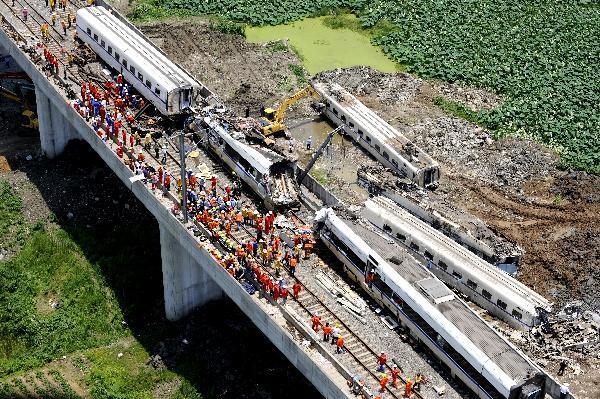 Aerial photo taken on July 24, 2011 shows the accident scene where rescuers clear the wreckage in Wenzhou, east China's Zhejiang Province, after a train collision and derailment that killed at least 35 and injured more than 200 Saturday night. 