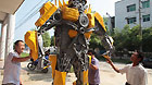 Citizens watch a 'transformer Bumblebee' made by a welder in Zhijiang City, central China's Hubei Province, July 25, 2011.