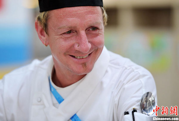 A chef in Shenzhen Universiade Village. The 26th World University Games will begin in Shenzhen, Guangdong Province, on Aug. 12.