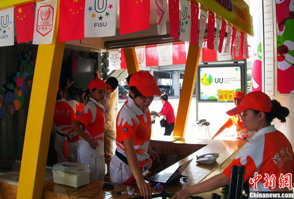 Volunteers in Shenzhen Universiade Village. The 26th World University Games will begin in Shenzhen, Guangdong Province, on Aug. 12. 