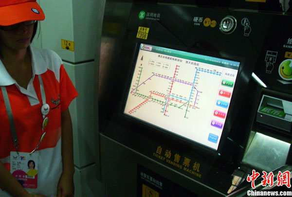 A volunteer in Shenzhen Universiade Village. The 26th World University Games will begin in Shenzhen, Guangdong Province, on Aug. 12. 