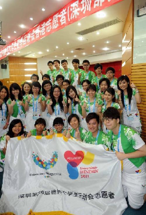 Volunteers from Hong Kong attend an oath-taking ceremony of the 26th World University Games in Shenzhen, south China's Guangdong Province, August 9, 2011.