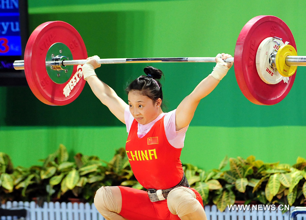 Xiao Hongyu of China competes during the women's 48kg weightlifting competition at the 26th Summer Universiade in Shenzhen, a city of south China's Guangdong Province, Aug. 13, 2011. 