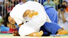 China's Qin Qian (front) fights with South Korea's Kim Na Young during their women's Judo +78 KG final match at the 26th Summer Universiade in Shenzhen, a city of south China's Guangdong Province, Aug. 13, 2011. Qin defeated Kim and got the first gold medal of Chinese delegation.