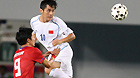 China's Yang Yang (top) heads the ball towards the goal in the team's group match against South Korea during the 26th Summer Universiade in Shenzhen, Aug 16, 2011.