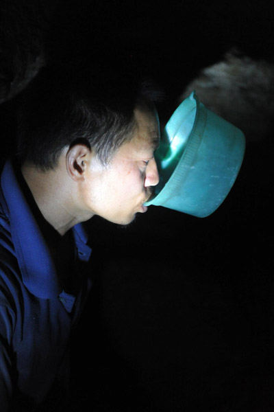 Wu drinks water from a cave in drought-hit Qinglong County, Guizhou Provincee, on Aug 17, 2011. 