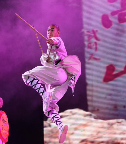 A Shaolin monk performs during a Shaolin kungfu show Shaolin Kungfu in the Wind at a theater in the Universiade Village in Shenzhen, Aug 16, 2011.