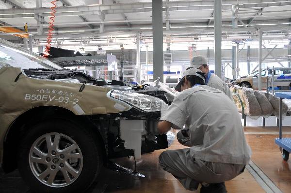 Photo taken on Aug. 22, 2011 shows the assemble lines of new energy cars in a workshop of China FAW New Energy Vehicle Branch in Changchun, capital of northeast China's Jilin Province.