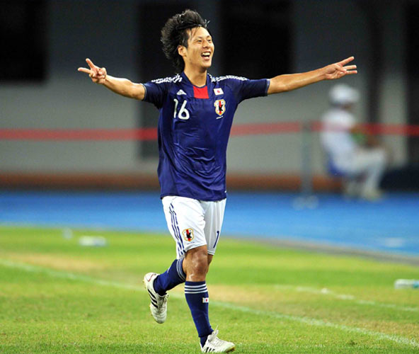 Kawamoto Akito of Japan celebrates scoring against Britain in the Universiade men's soccer finals at the Shenzhen Stadium in Shenzhen, Aug 22, 2011.