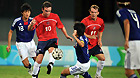 British forward Mark Anderson (10) fights for the ball with Japanese players in the Universiade men's soccer finals at the Shenzhen Stadium in Shenzhen, Aug 22, 2011.