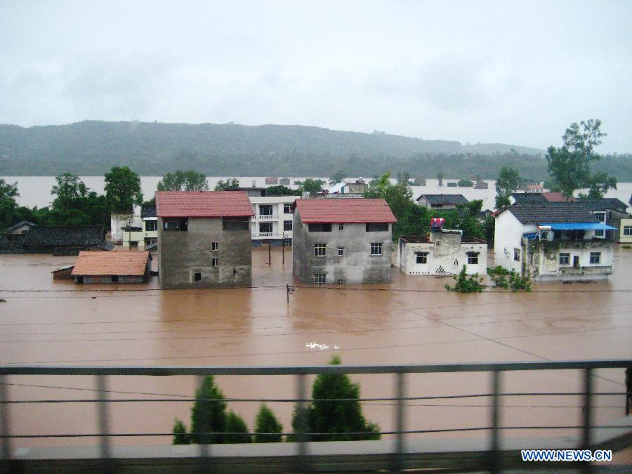 Homes are inundated in floodwaters in Quxian County, southwest China&apos;s Sichuan Province, Sept. 19, 2011.