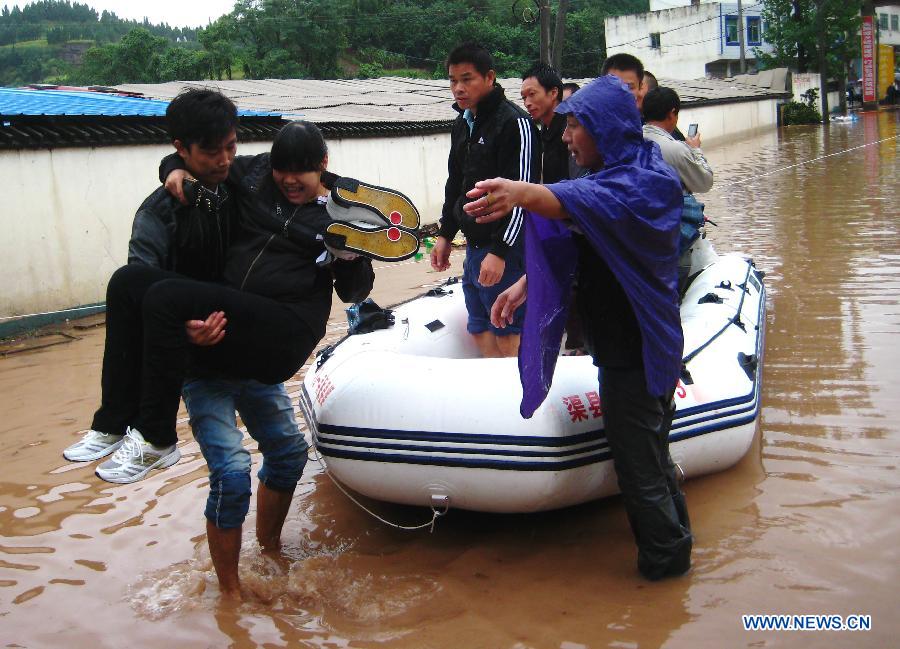 A pregnant lady is put onto a life boat in Quxian County, southwest China&apos;s Sichuan Province, Sept. 19, 2011. 