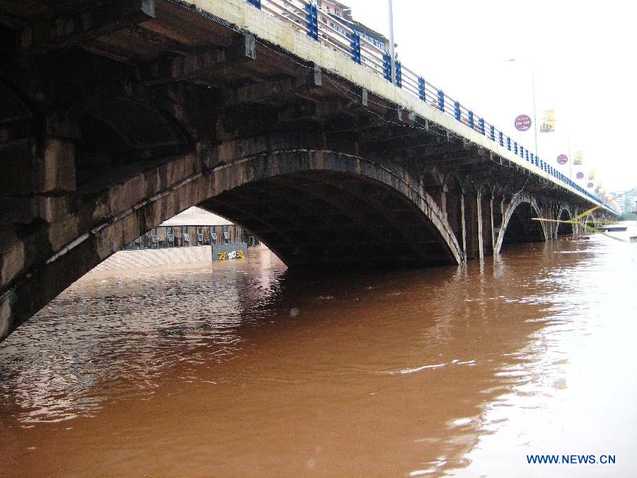 Rising waters submerge the piers of the Qujiang Bridge in Quxian County, southwest China&apos;s Sichuan Province, Sept. 19, 2011. 