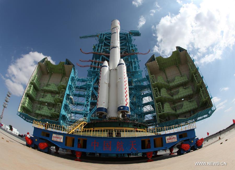 A Long March 2F carrier rocket loaded with 'Tiangong-1', China's unmanned space module, is moved to the launch pad at the Jiuquan Satellite Launch Center in northwest China's Gansu Province, Sept. 9, 2011.\