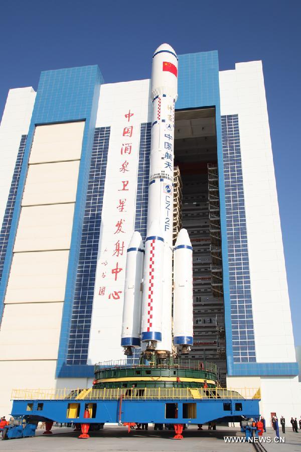 A Long March 2F carrier rocket loaded with 'Tiangong-1', China's unmanned space module, is moved to the launch pad at the Jiuquan Satellite Launch Center in northwest China's Gansu Province, Sept. 9, 2011.