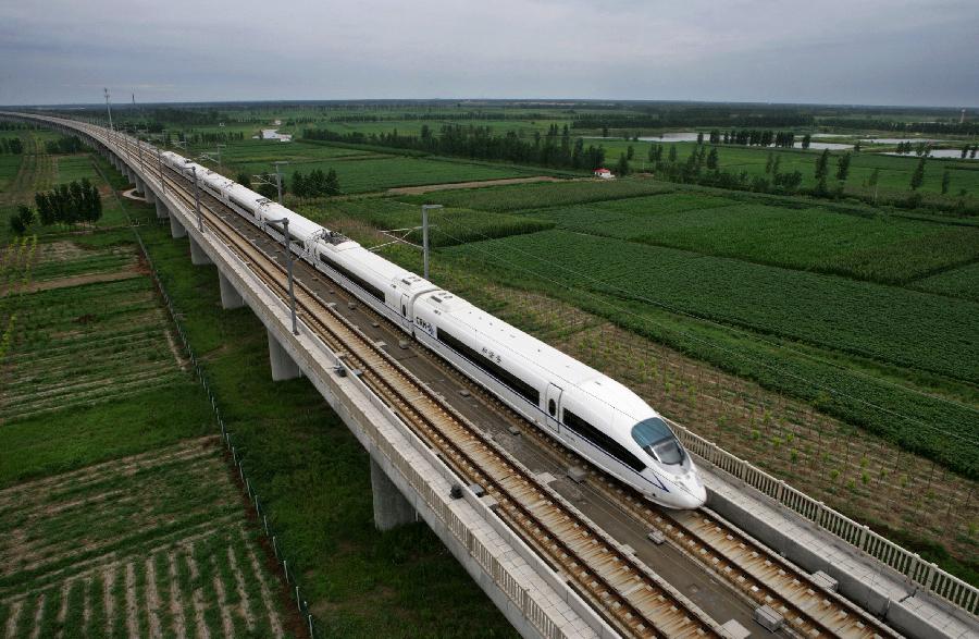 File photo taken on Aug. 1, 2008 shows a bullet train runs through the Yangcun Bridge of the Beijing-Tianjin Express Line in north China&apos;s Tianjin Municipality.