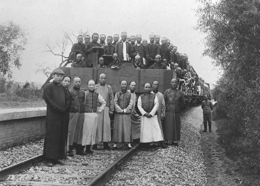 File photo taken in 1909 shows Zhan Tianyou (3rd R, Front) poses for a group photo with his colleagues for the completion of the Beijing-Zhangjiakou Railway. 