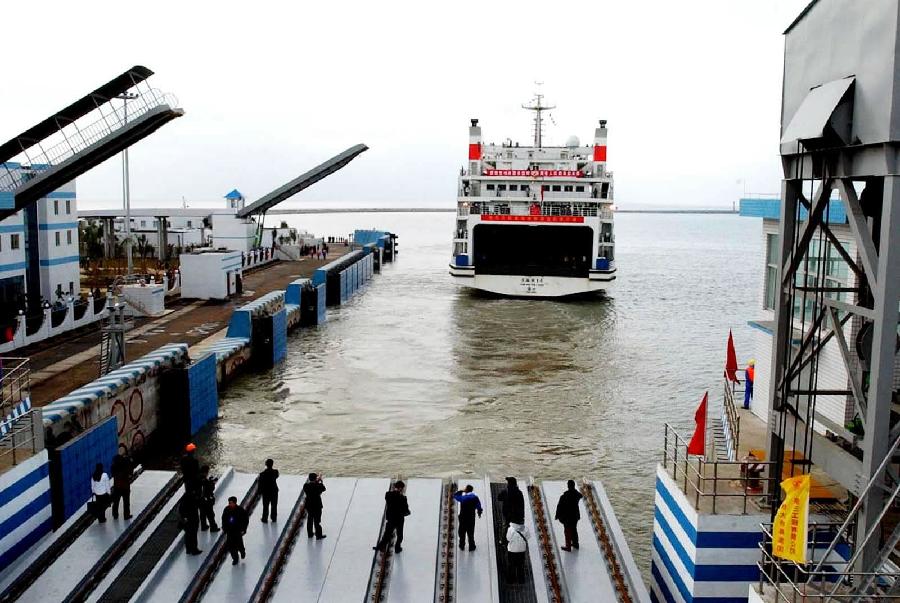 File photo taken on Jan. 7, 2003 shows a train ferry carrying a freight train leaves the Beigang wharf in Zhanjiang City, south China&apos;s Guangdong Province. China&apos;s first cross-sea railway was open to traffic on that day. 