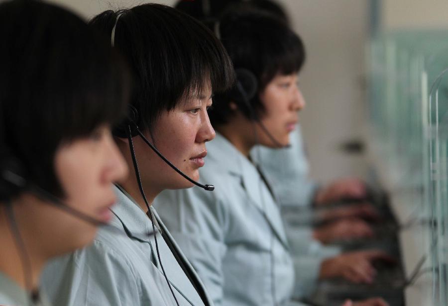 Staff workers are seen at the Jiuquan Satellite Launch Center in northwest China&apos;s Gansu Province, Sept. 27, 2011. 