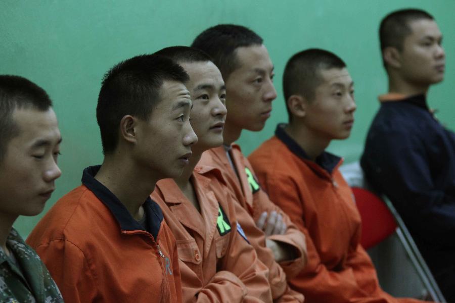 Technicians are seen at the Jiuquan Satellite Launch Center in northwest China&apos;s Gansu Province, Sept. 28, 2011. 