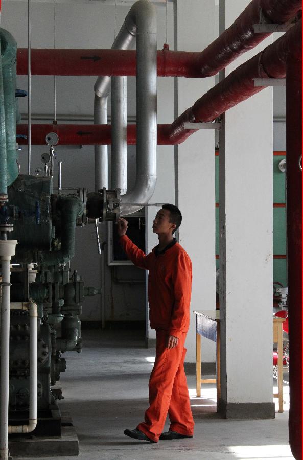 A technician examines facilities at the Jiuquan Satellite Launch Center in northwest China&apos;s Gansu Province, Sept. 28, 2011.