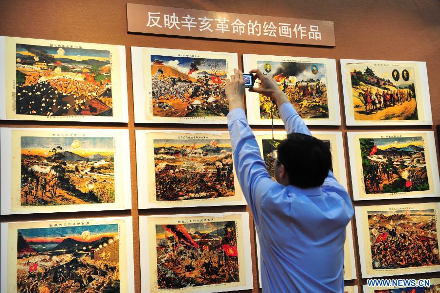 A man visits an exhibition commemorating the centennial of the 1911 (Xinhai) Revolution, in Shanghai, east China, Oct. 9, 2011. 