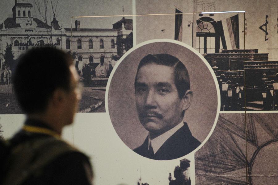 A visitor views the pictures at an exhibition to commemorate the 1911 Revolution in Dr. Sun Yat-Sen Memorial Hall in Taipei, southeast China&apos;s Taiwan, Oct. 8, 2011. 