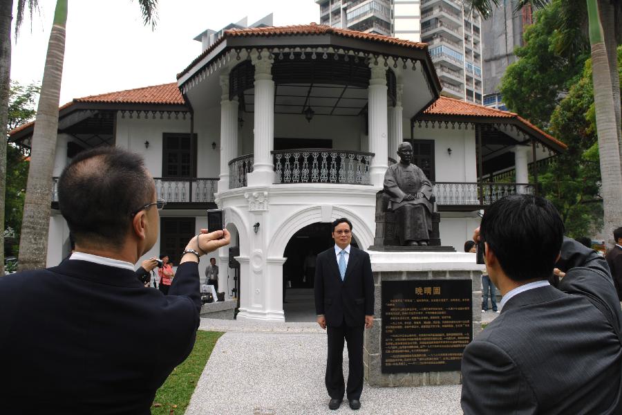 Guests take photos at Sun Yat-Sen Nanyang Memorial Hall in Singapore on Oct. 8, 2011. 