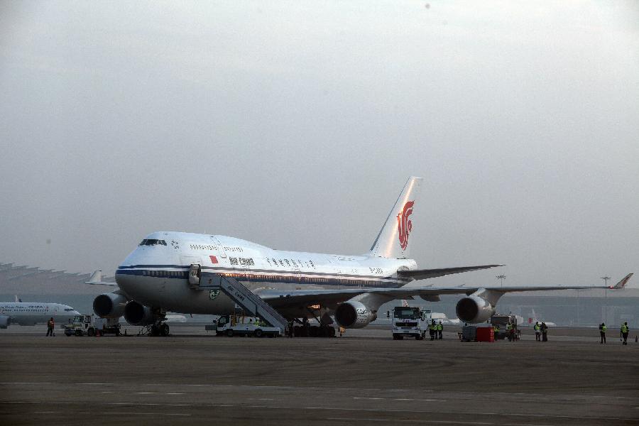 A boeing 747-400 plane using mixed fuel of biofuel and traditional aviation kerosene taxies before the test flight in Beijing, capital of China, Oct. 28, 2011. 