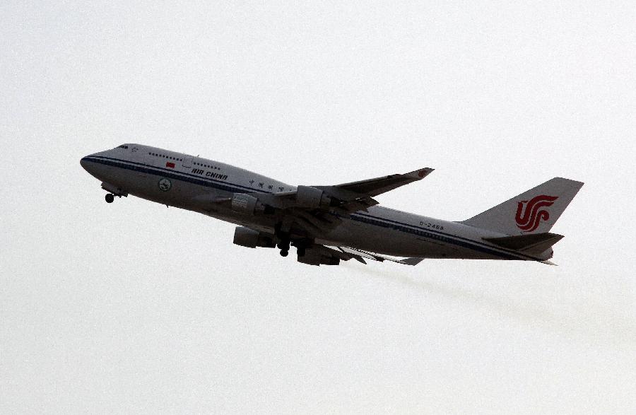 A boeing 747-400 plane using mixed fuel of biofuel and traditional aviation kerosene flies during the test flight in Beijing, capital of China, Oct. 28, 2011.