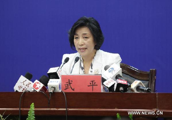 Wu Ping, spokeswoman for China's manned space program, speaks during a press conference in Jiuquan of northwest China's Gansu Province, Oct. 31, 2011. 