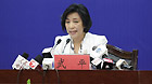 Wu Ping, spokeswoman for China's manned space program, speaks during a press conference in Jiuquan of northwest China's Gansu Province, Oct. 31, 2011.