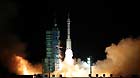 A modified model of the Long March CZ-2F rocket carrying the unmanned spacecraft Shenzhou-8 blasts off from the launch pad at the Jiuquan Satellite Launch Center in northwest China's Gansu Province, Nov. 1, 2011.