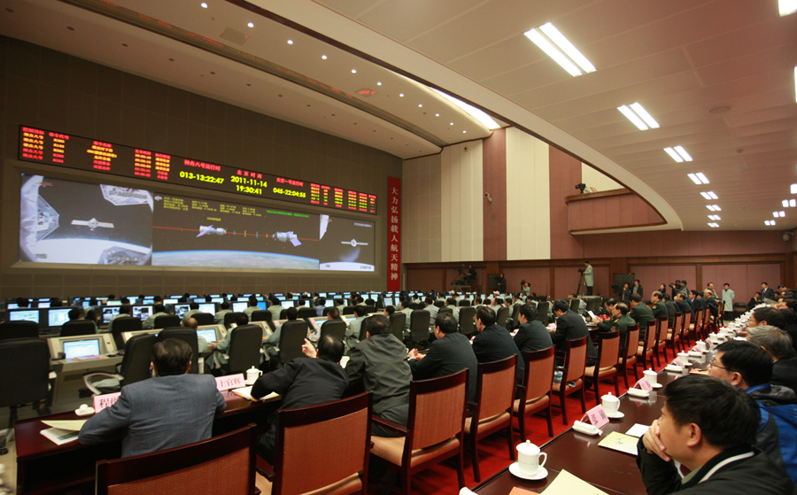 Photo taken on Nov. 14, 2011 shows the scene in the Beijing Aerospace Flight Control Center, in Beijing, capital of China. China&apos;s Shenzhou-8 unmanned spacecraft successfully re-docked with the Tiangong-1, a module of the country&apos;s planned space lab on Monday.