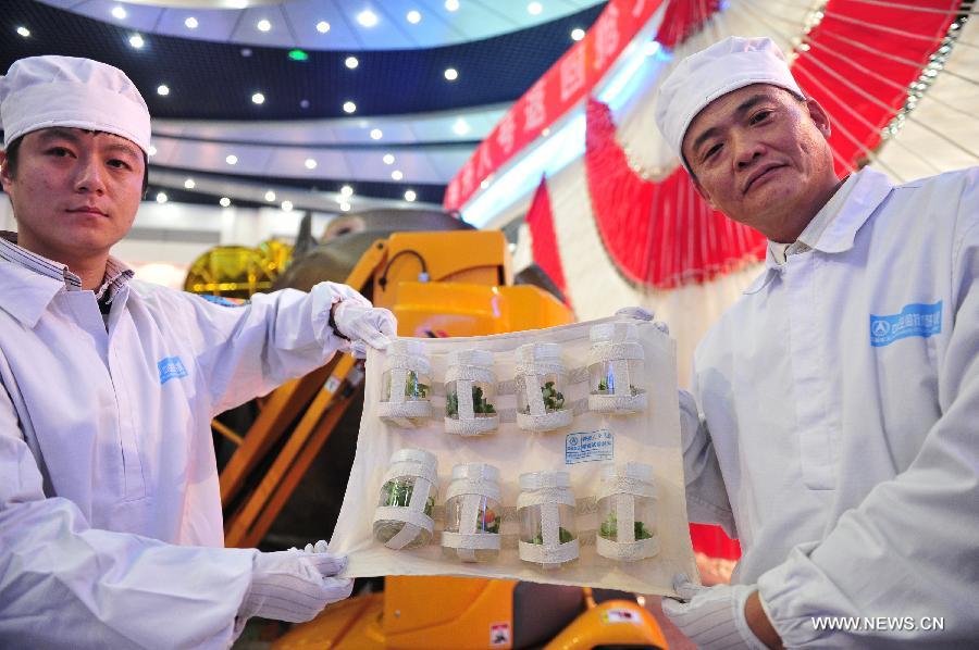 Researchers demonstrate a set of space flowering and fructification experiment devices retrieved from the re-entry capsule of China&apos;s unmanned spacecraft Shenzhou-8 in Beijing, capital of China, Nov. 21, 2011. 