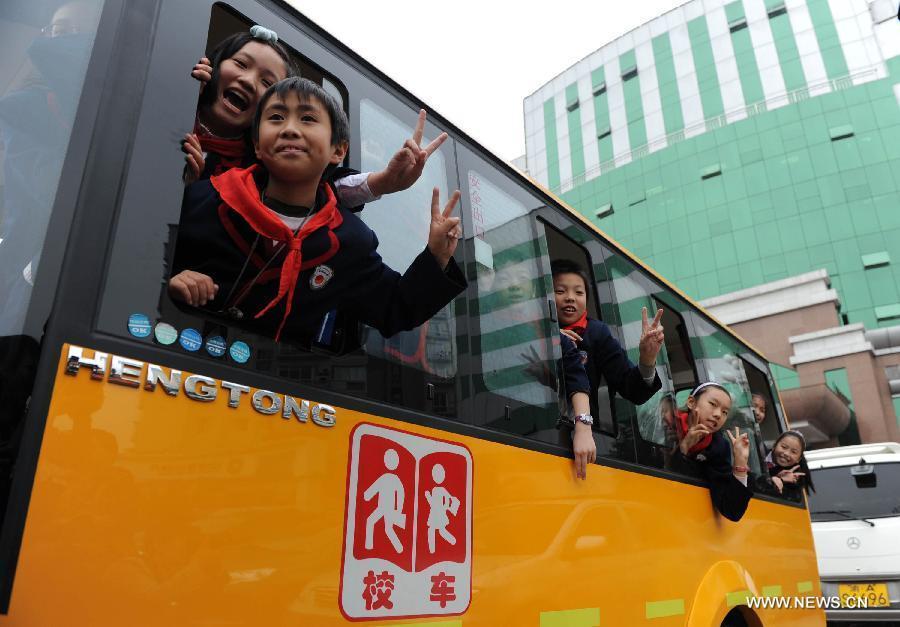 Children experience on a new school bus in Chongqing, southwest China, Nov. 22, 2011. 