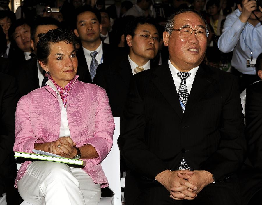 Xie Zhenhua (R), deputy director of the National Development and Reform Commission, and Christina Figueres, Executive Secretary of the United Nations&apos; Framework Convention on Climate Change (UNFCCC) attend the launching ceremony of the Chinese Pavalion to the 17th Conference of Parties (COP17) to the UNFCCC in Durban, Soth Africa, Dec. 4, 2011. 